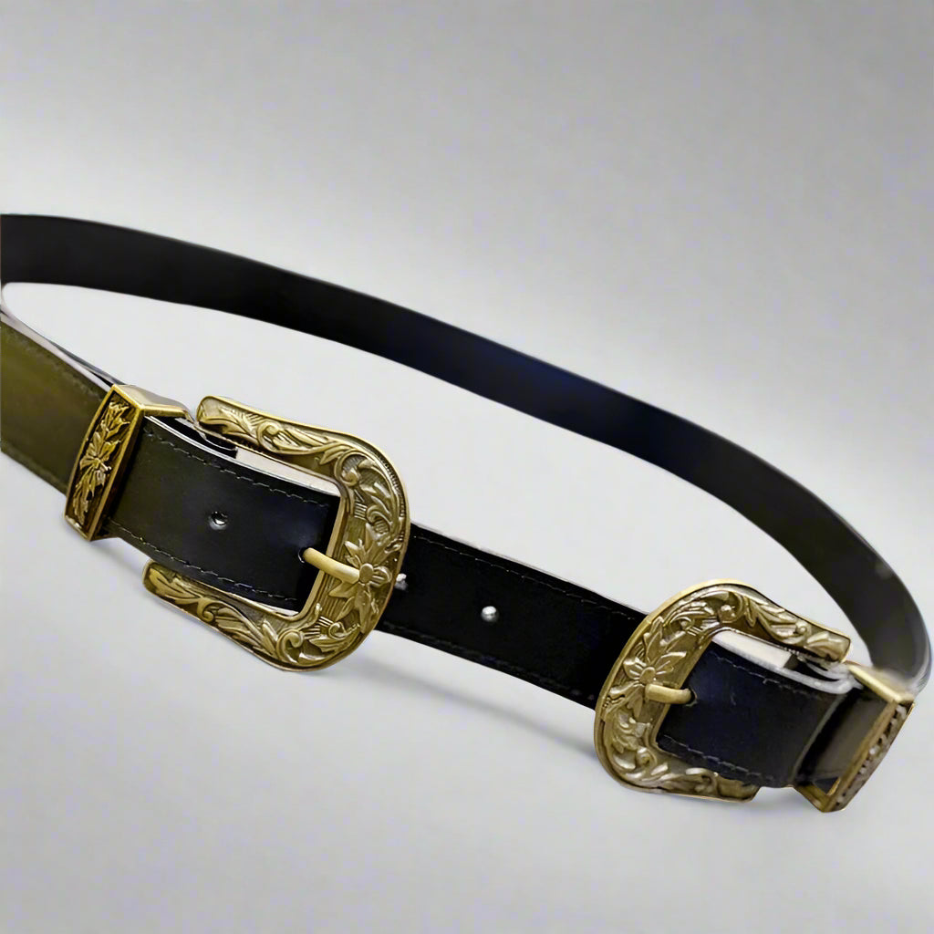 Black vegan leather Western double-buckle belt with bronze-colored buckles, displayed on a flat surface.