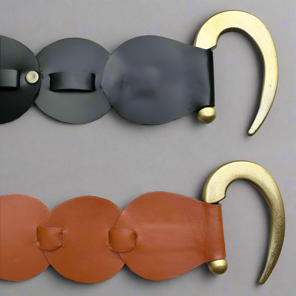 Two vegan leather belts with gold-colored hooks, one black and one brown, displayed flat.