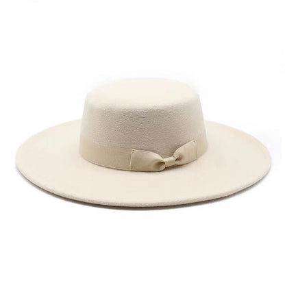 Vegan felt Boater hat, four colours. All hats are adjustable. The hats come with a matching cotton decorative belt. This wide brimmed boater hat is crafted from a cotton and polyester blend, so cruelty free to animals, and the hats are made in a small studio in China, where staff are paid well and work in a safe place.