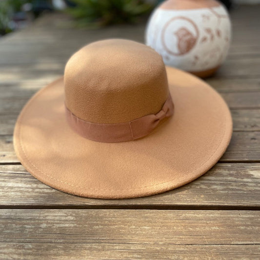 Vegan felt Boater hat, four colours. All hats are adjustable. The hats come with a matching cotton decorative belt. This wide brimmed boater hat is crafted from a cotton and polyester blend, so cruelty free to animals, and the hats are made in a small studio in China, where staff are paid well and work in a safe place.