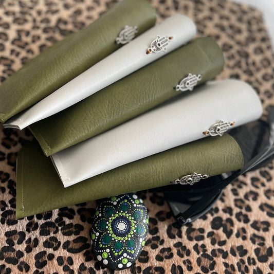 Keep your sunglasses safe in our new handmade AHIMSA vegan leather case. Available in White and Green with a Hamsa hand embellishment. Vegan accessories, cruelty-free fashion, ethical slow fashion. Fast delivery from Sydney Australia. Female-owned and vegan small business. Jain do no harm symbol yoga spiritualism