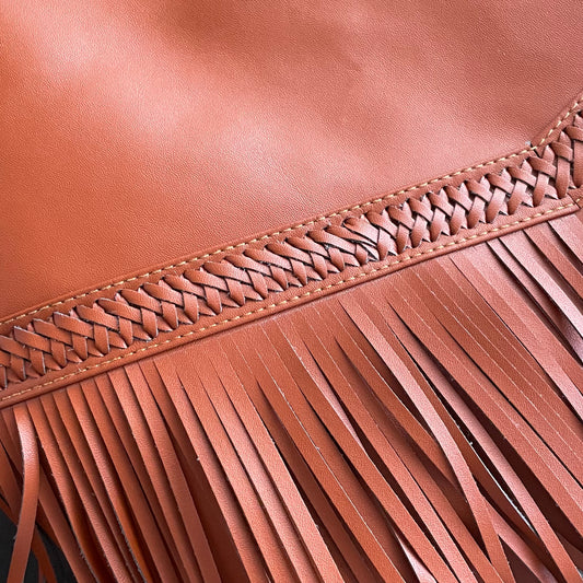 ADALITA is our vintage look and feel fringed vegan leather handbag in tan. Handmade in Bali in fair work and pay conditions. Made with quality PU and Microfibre leather, a cruelty-free alternative and an ethical sustainable choice. Fast delivery from Sydney Australia. Female-owned and vegan small business. Boho style.