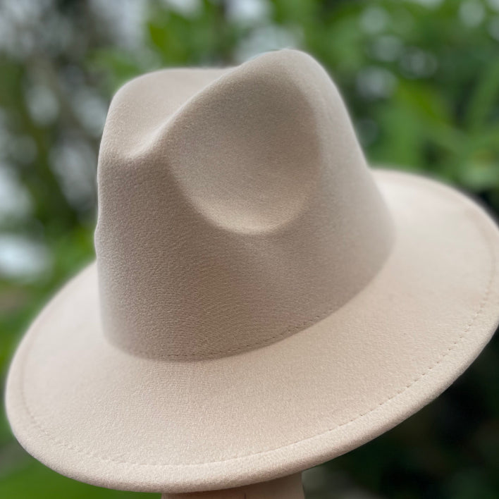 Vegan felt fedora hat, four colours. All hats are adjustable. The hats come with a matching cotton decorative belt. This wide brimmed boater hat is crafted from a cotton and polyester blend, so cruelty free to animals, and the hats are made in a small studio in China, where staff are paid well and work in a safe place.