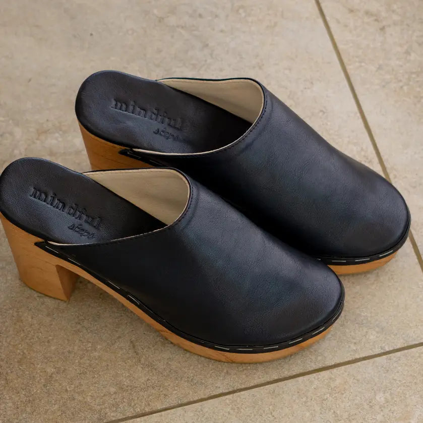 Lightweight wooden clogs.  Vegan shoes for women. Padded cushioned base. Vegan heeled clogs in black. Vegan shoes Australia. Black quality comfortable clogs. Handmade in fair working conditions in Bali. Vegan Shoes Australia Women's vegan shoes Vegan boots. Vegan shoes and accessories, mules clogs sandals.