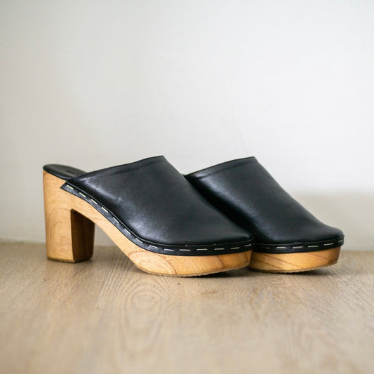 Lightweight wooden clogs.  Vegan shoes for women. Padded cushioned base. Vegan heeled clogs in black. Vegan shoes Australia. Black quality comfortable clogs. Handmade in fair working conditions in Bali. Vegan Shoes Australia Women's vegan shoes Vegan boots. Vegan shoes and accessories, mules clogs sandals.